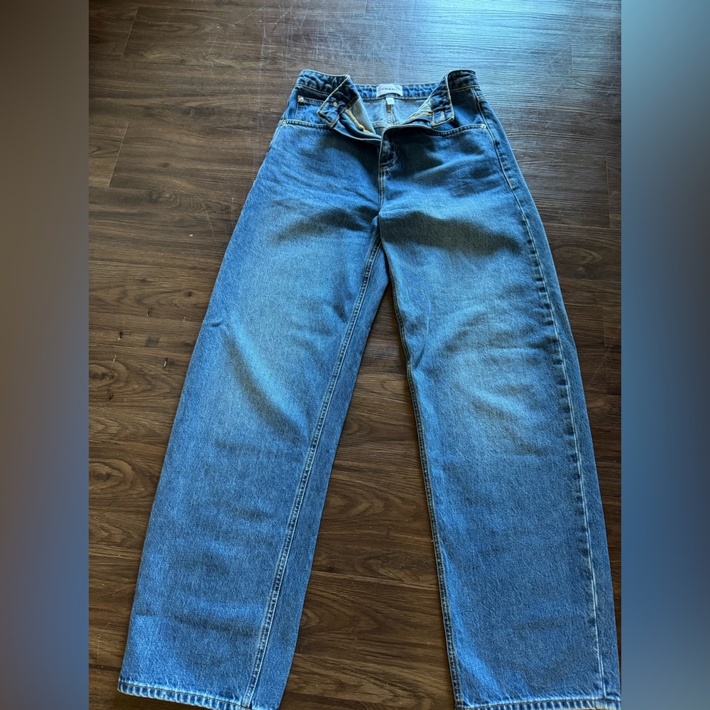 FRAME high-rise barrel leg jeans in classic blue denim. Women